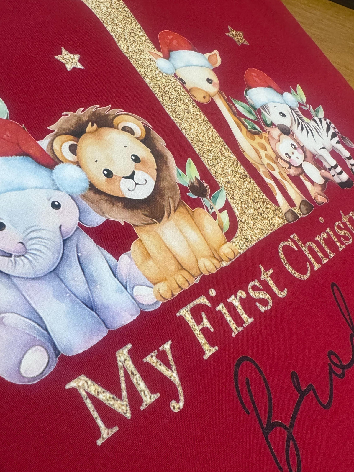 Personalised red drawstring Christmas sack open and ready to be filled with baby's first Christmas gifts