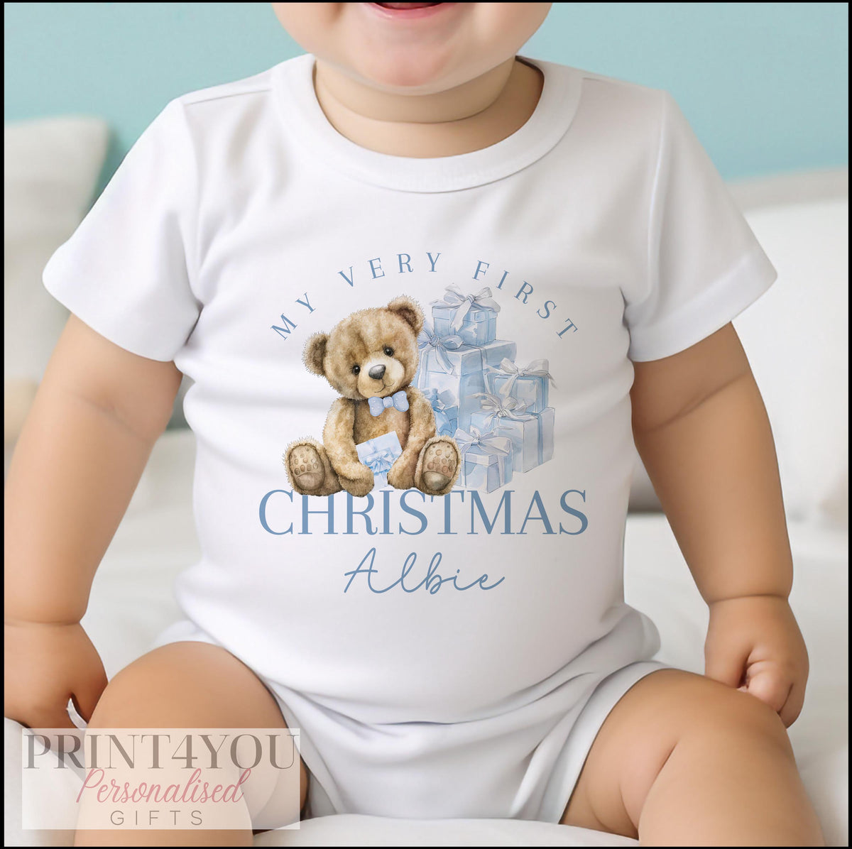 Close-up of the festive design and personalised text on the baby Christmas vest.