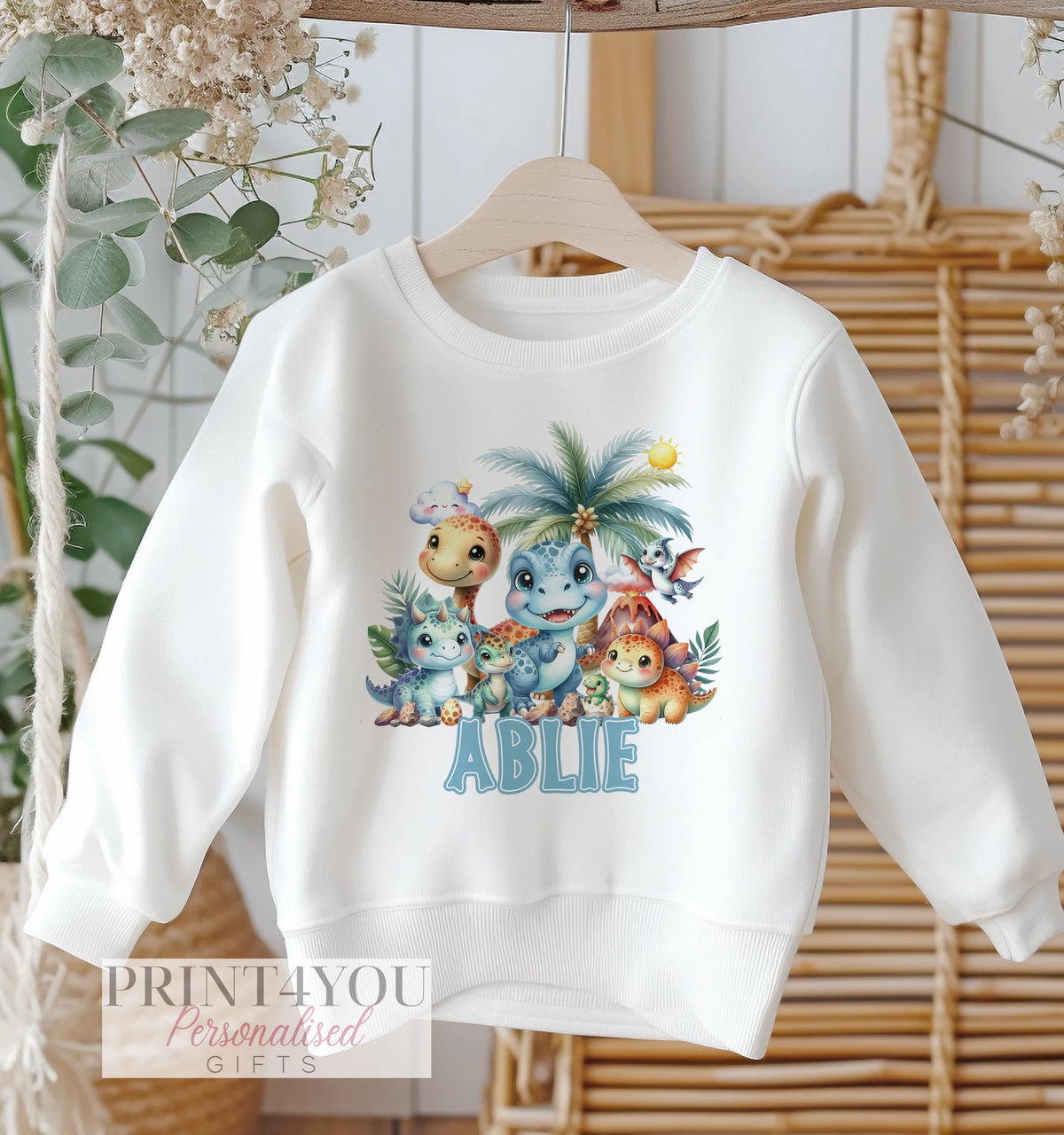 White sweatshirt with cute blue dinosaur print and personalised name, size 6-12 months