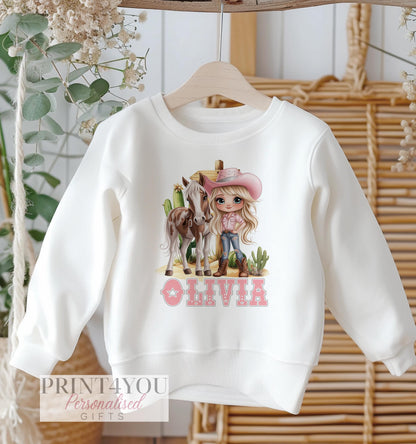 Personalised pink cowgirl western design on a white cotton kids' sweatshirt, size 6-12 months.