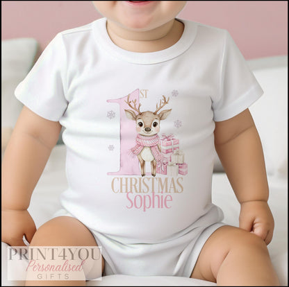 Personalised baby's first Christmas vest with a pink reindeer print, front view.