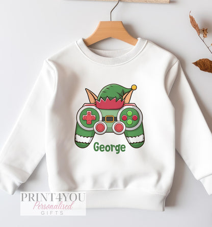 White cotton sweatshirt for babies with a personalised elf gaming controller Christmas design, size 6-12 months