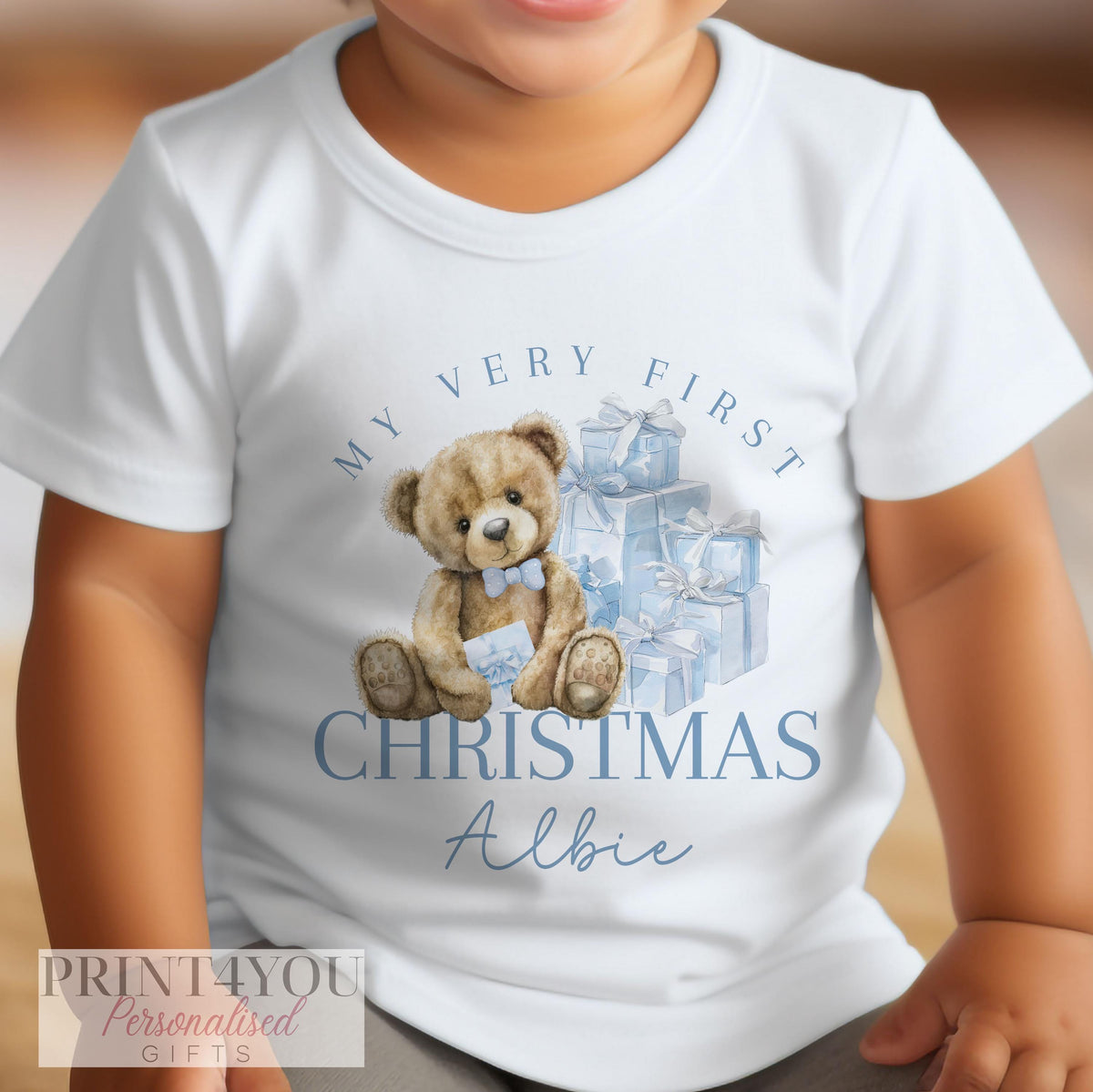 Personalised baby Christmas vest laid flat to show the full festive print and sizing.