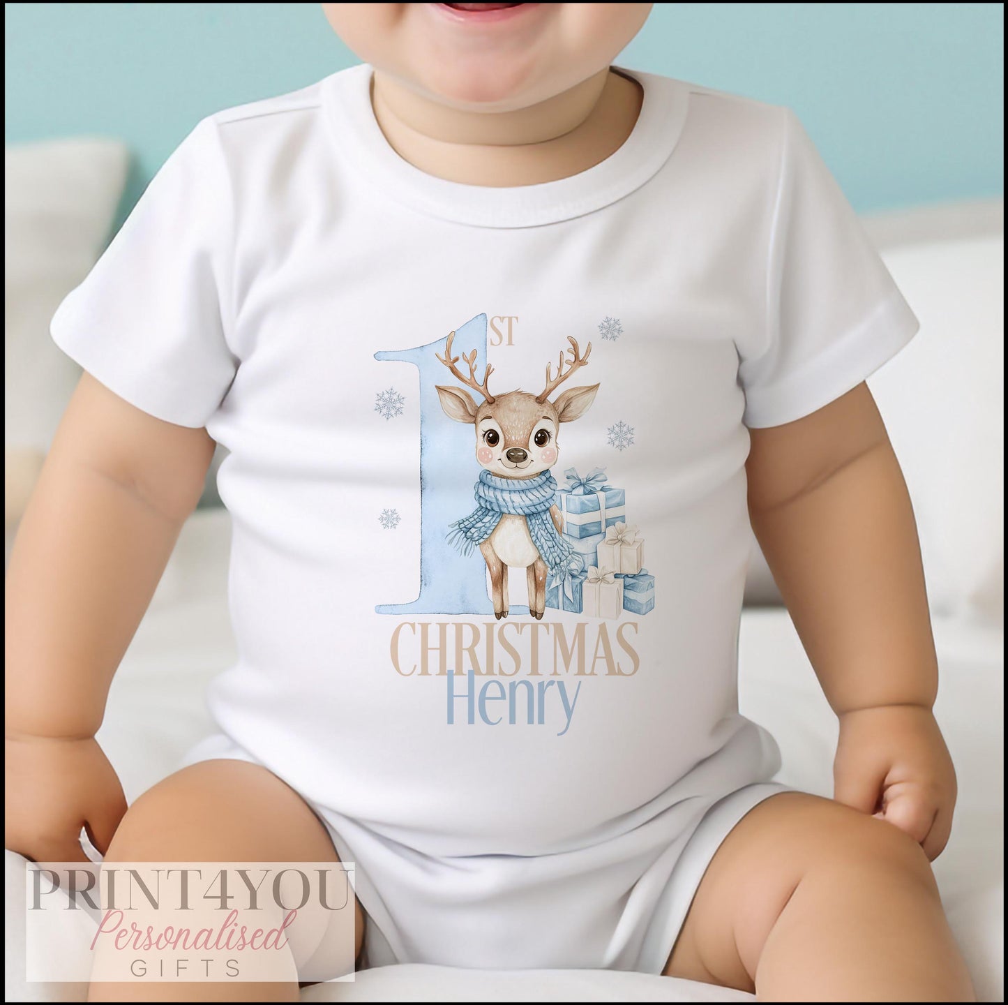 Personalised blue reindeer vest for baby's first Christmas, front view showing custom name