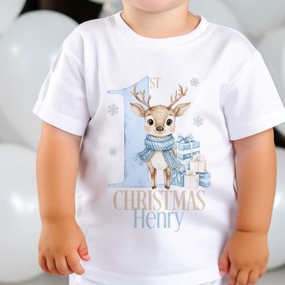 Close-up of the blue reindeer print and personalised name on a baby's first Christmas vest