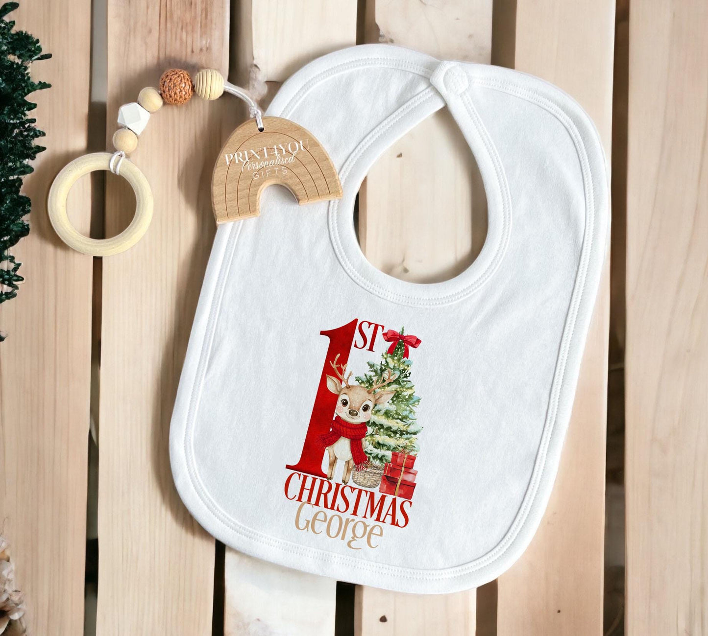 Personalised red reindeer sleepsuit for baby's first Christmas, printed with a custom name