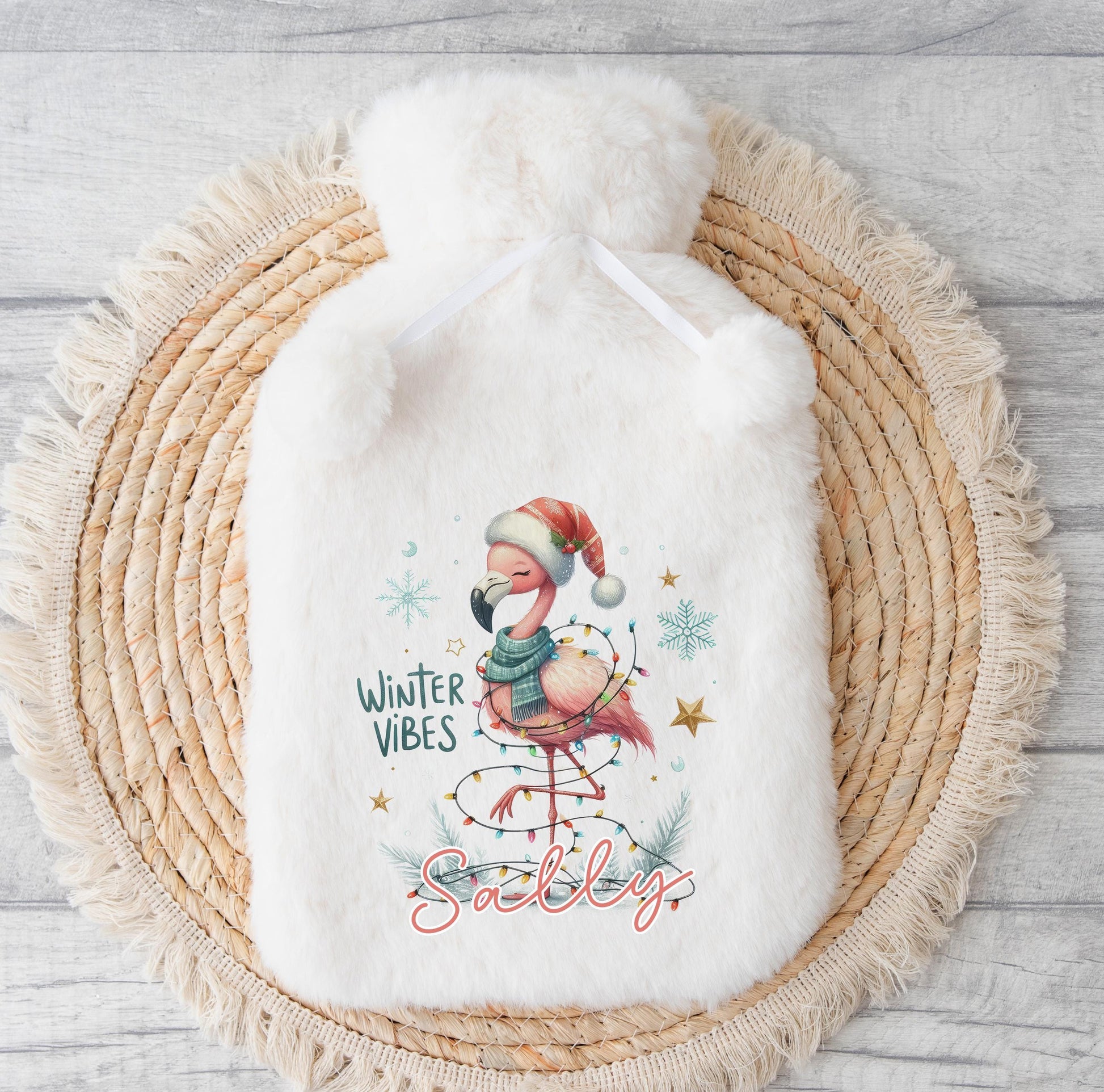 Personalised Christmas hot water bottle with a fluffy polyester cover and custom name printed on the front.