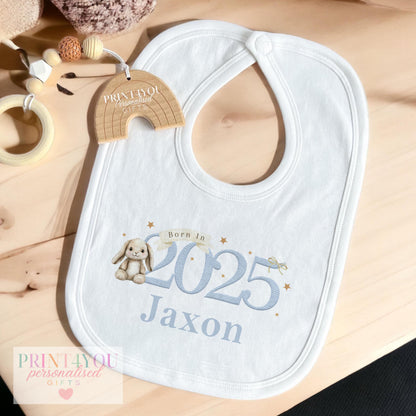 Close-up of the blue bunny print on the personalised newborn vest.