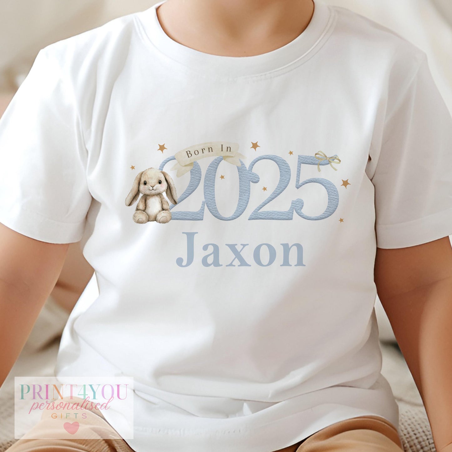 Personalised 'Born In 2025' blue bunny sleepsuit for newborn babies.