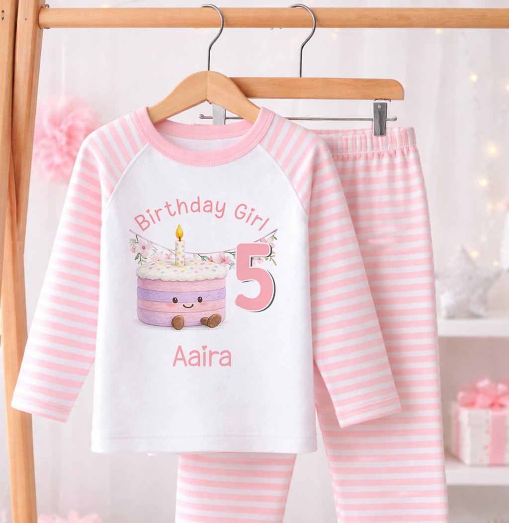 Pink and white striped pyjama set printed with a personalised name, laid flat against a white background