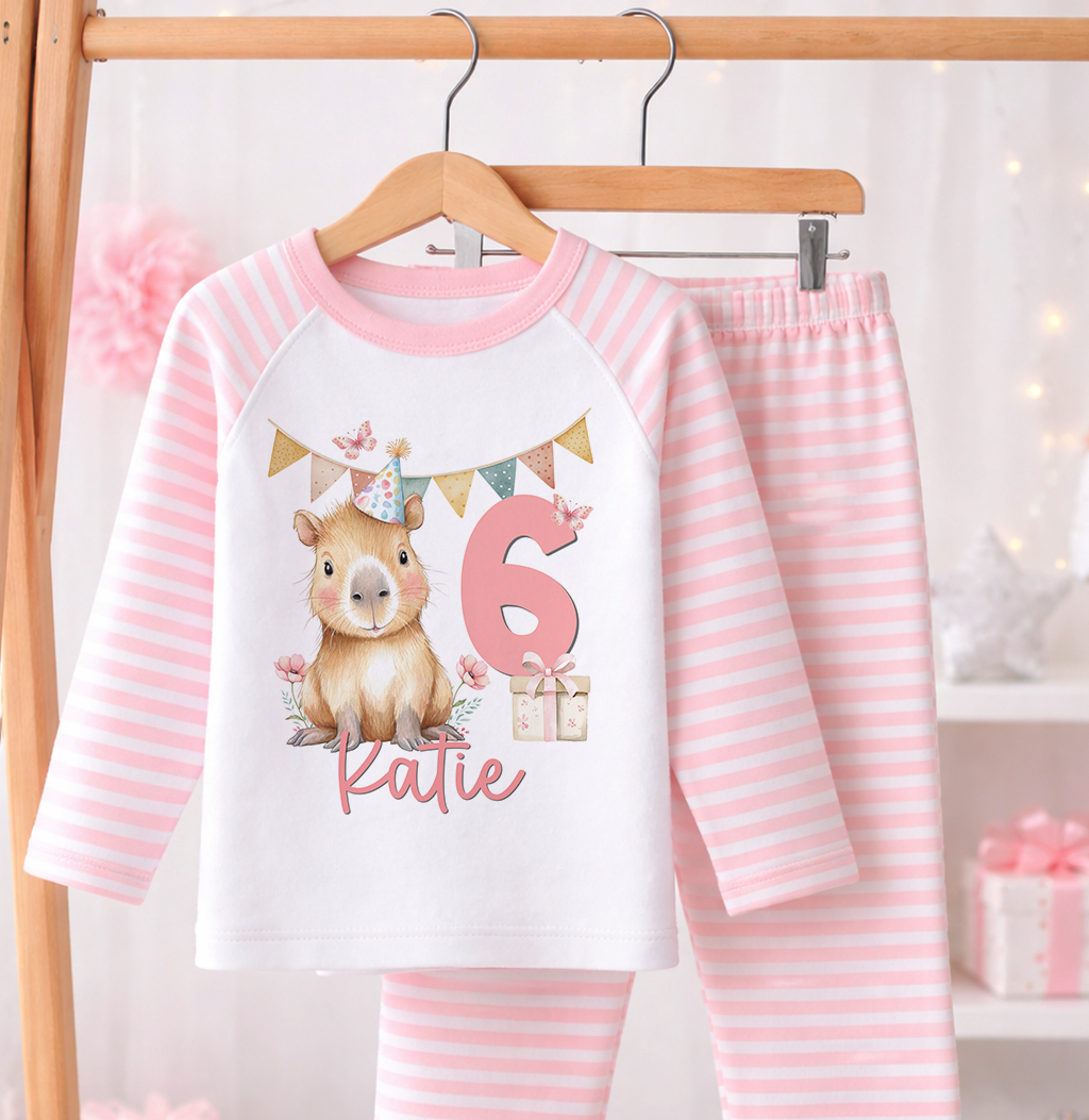 Personalised pink stripe pyjamas for a girl's 6th birthday with custom name print