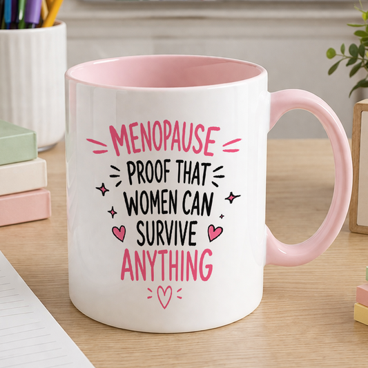 White ceramic mug with pink handle and pink inner printed with Menopause proof that women can survive anything