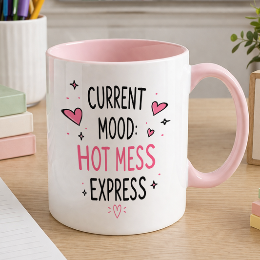 White ceramic mug with pink handle printed with the slogan Current mood hot mess express