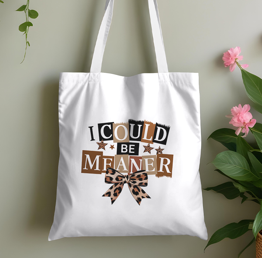 Plain cotton tote bag printed with a bold statement slogan, laid flat against a plain background