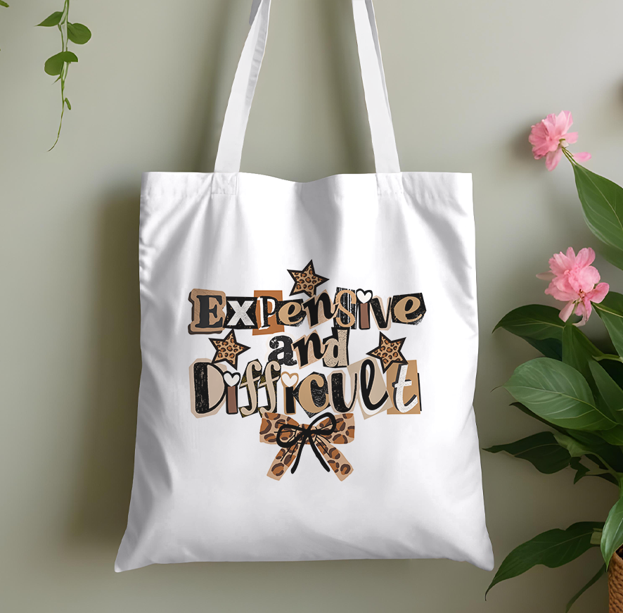 Plain cotton tote bag printed with a bold statement slogan, laid flat against a plain background