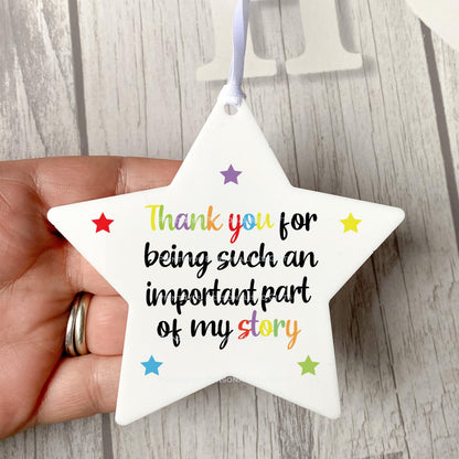 Rainbow star hanging decoration displayed against a plain background.
