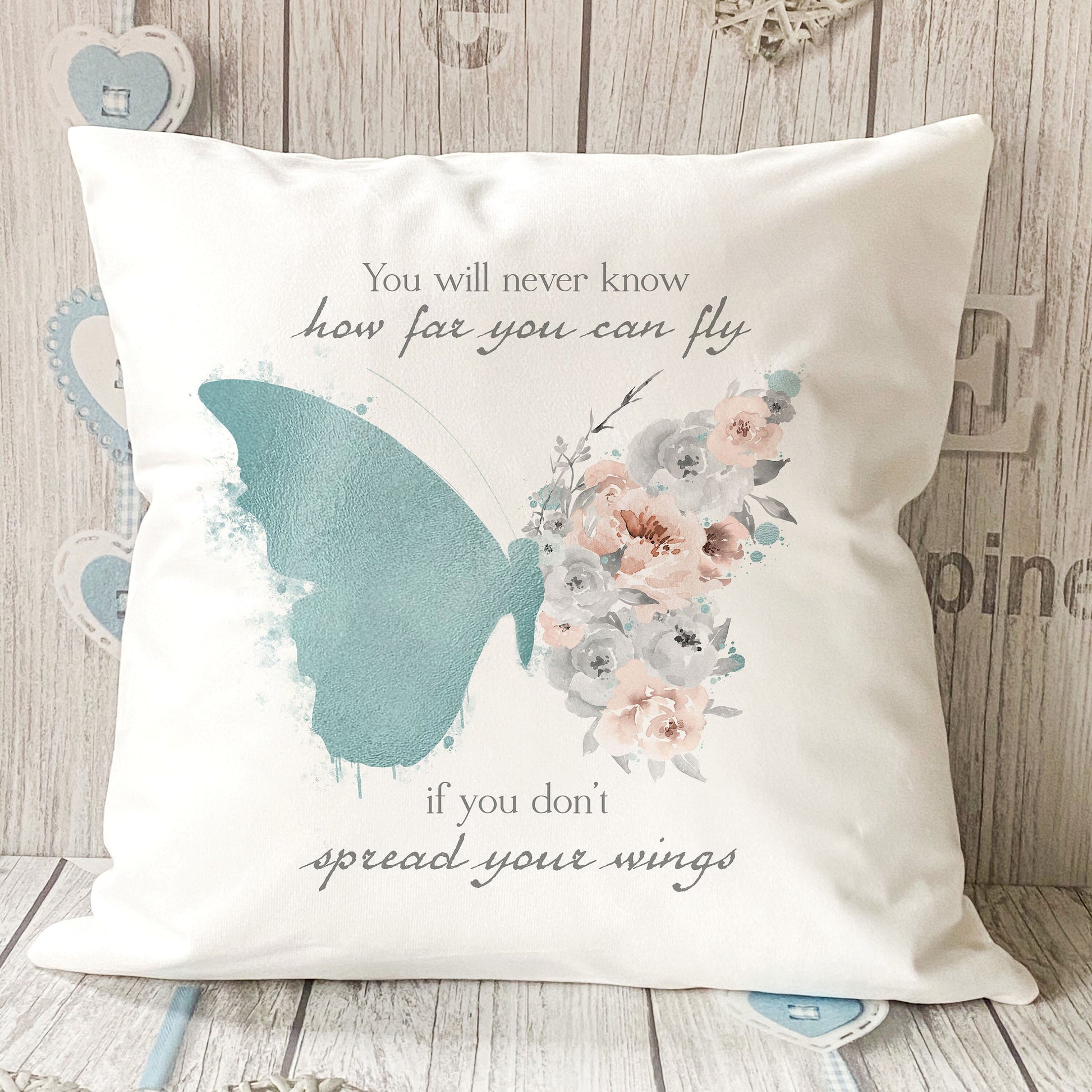 Personalised teal butterfly quote velvet cushion styled on a sofa, 40x40cm – Print4You Personalised Gifts