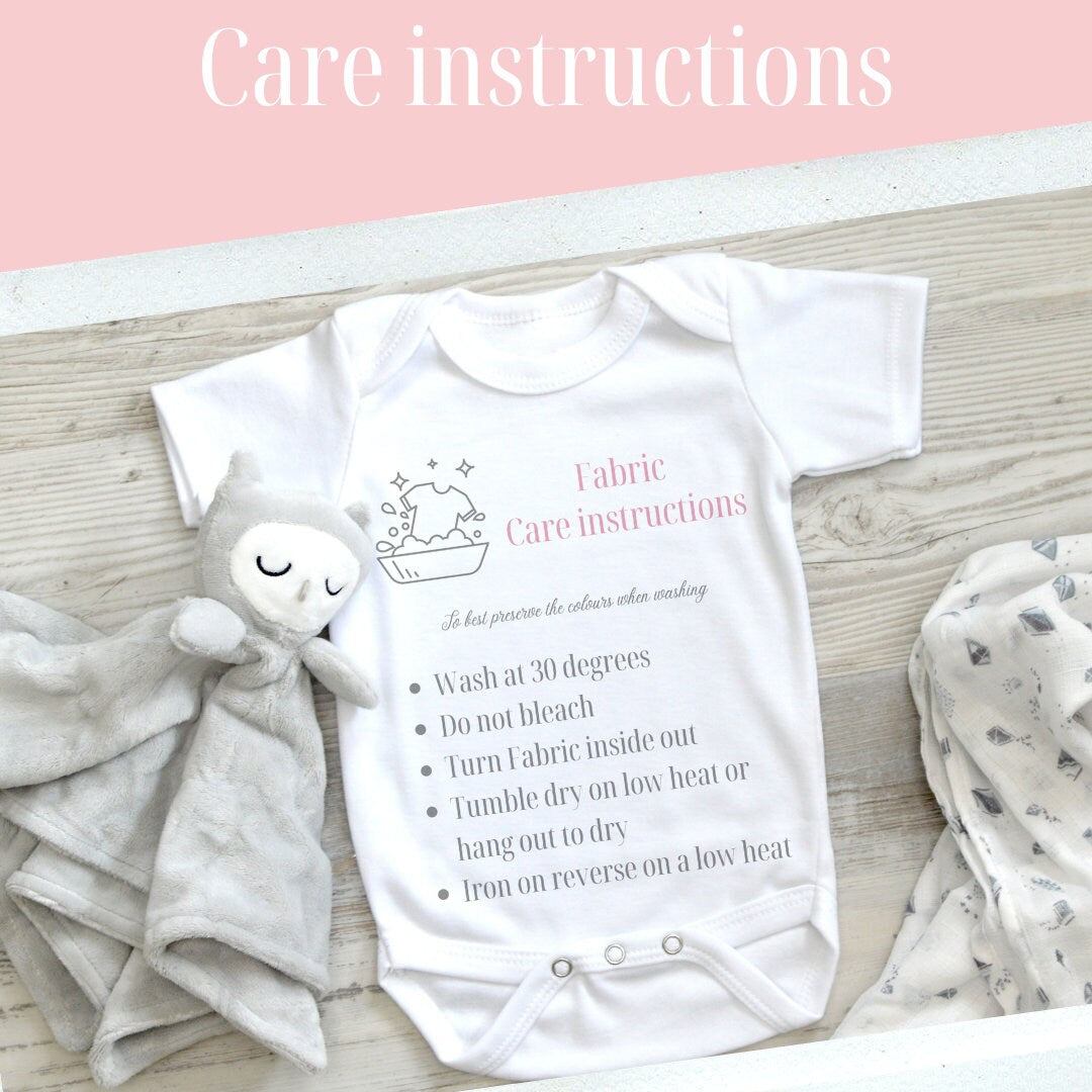 Personalised Elephant Alphabet baby t-shirt, flat lay on soft cotton.