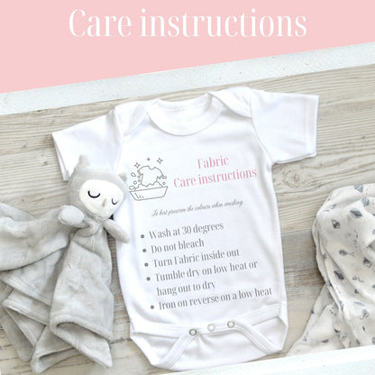 Personalised Elephant Alphabet baby t-shirt, flat lay on soft cotton.
