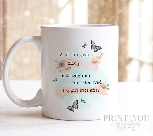 White ceramic mug printed with the sarcastic quote 'And she gave zero f*s and lived happily ever after'