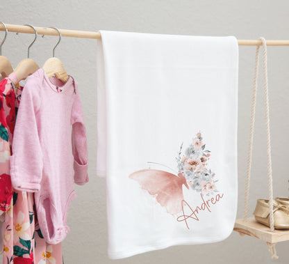 Blush butterfly baby bib styled for a new baby photoshoot.