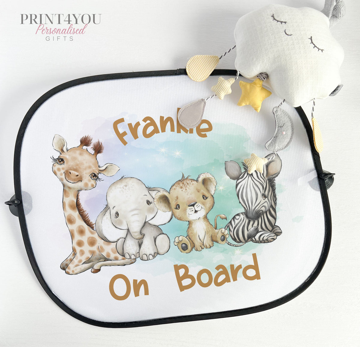 Pair of white netted car window sun shades printed with safari jungle animal designs, attached with suction cups.
