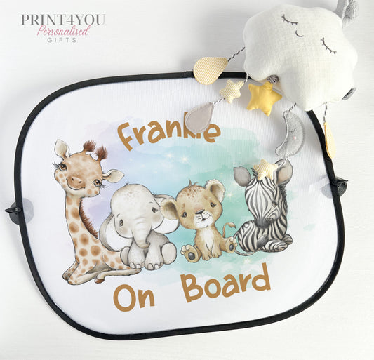 Pair of white netted car window sun shades printed with safari jungle animal designs, attached with suction cups.