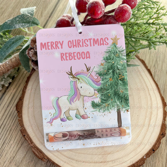 Personalised tree-shaped acrylic money holder with a unicorn reindeer design and custom name, hanging by a ribbon