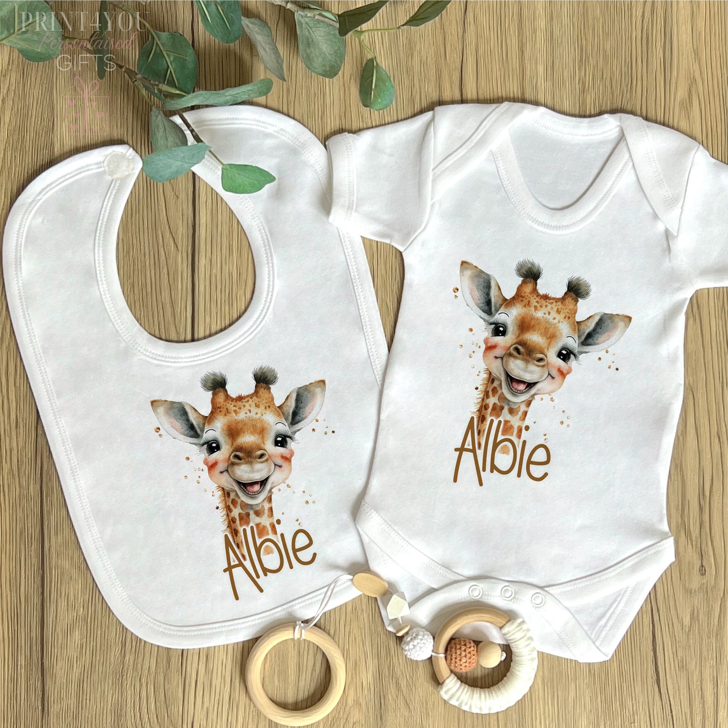 Close-up of the safari giraffe design and personalised name print on soft cotton.