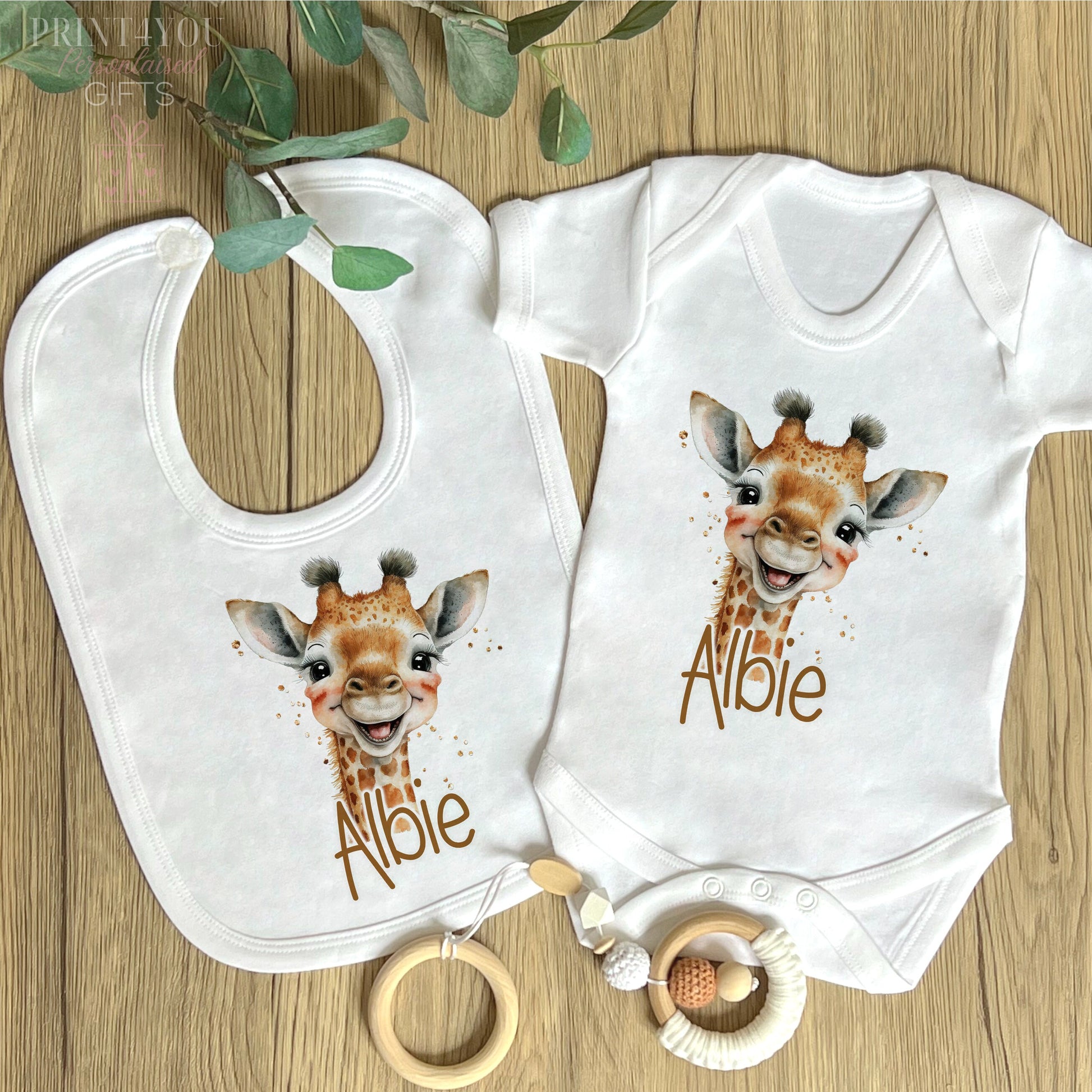 Close-up of the safari giraffe design and personalised name print on soft cotton.