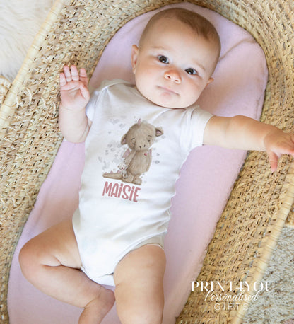 Personalised vest featuring the pink baby dragon print, in soft white cotton.
