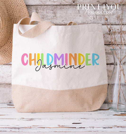 Cream and natural jute tote bag printed with colourful 'Childminder' lettering and the personalised name Jasmine, medium size.