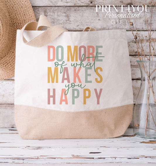 Cream and natural jute tote bag printed with the colourful positivity slogan 'Do more of what makes you happy', medium size.