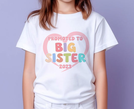 Promoted to Big Sister Heart Design White Cotton T – Shirt – Pastel Colours - 6-12 months  T-shirt