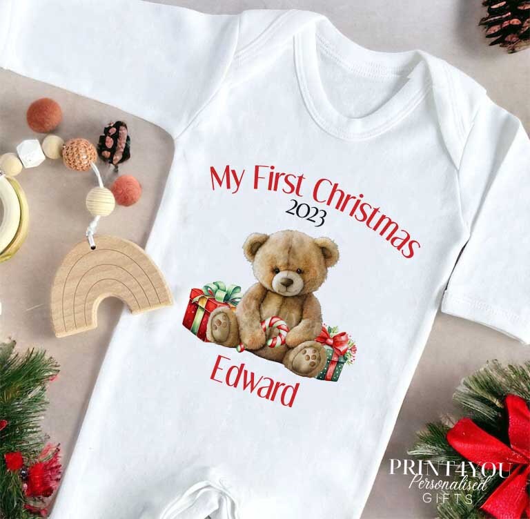 Personalised Baby's First Christmas bib with custom name and teddy bear design on white cotton.