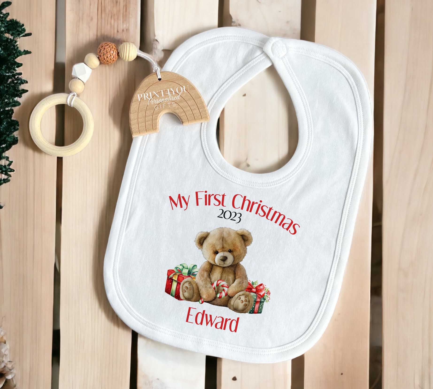 Personalised Baby's First Christmas vest with custom name and teddy bear design on white cotton.