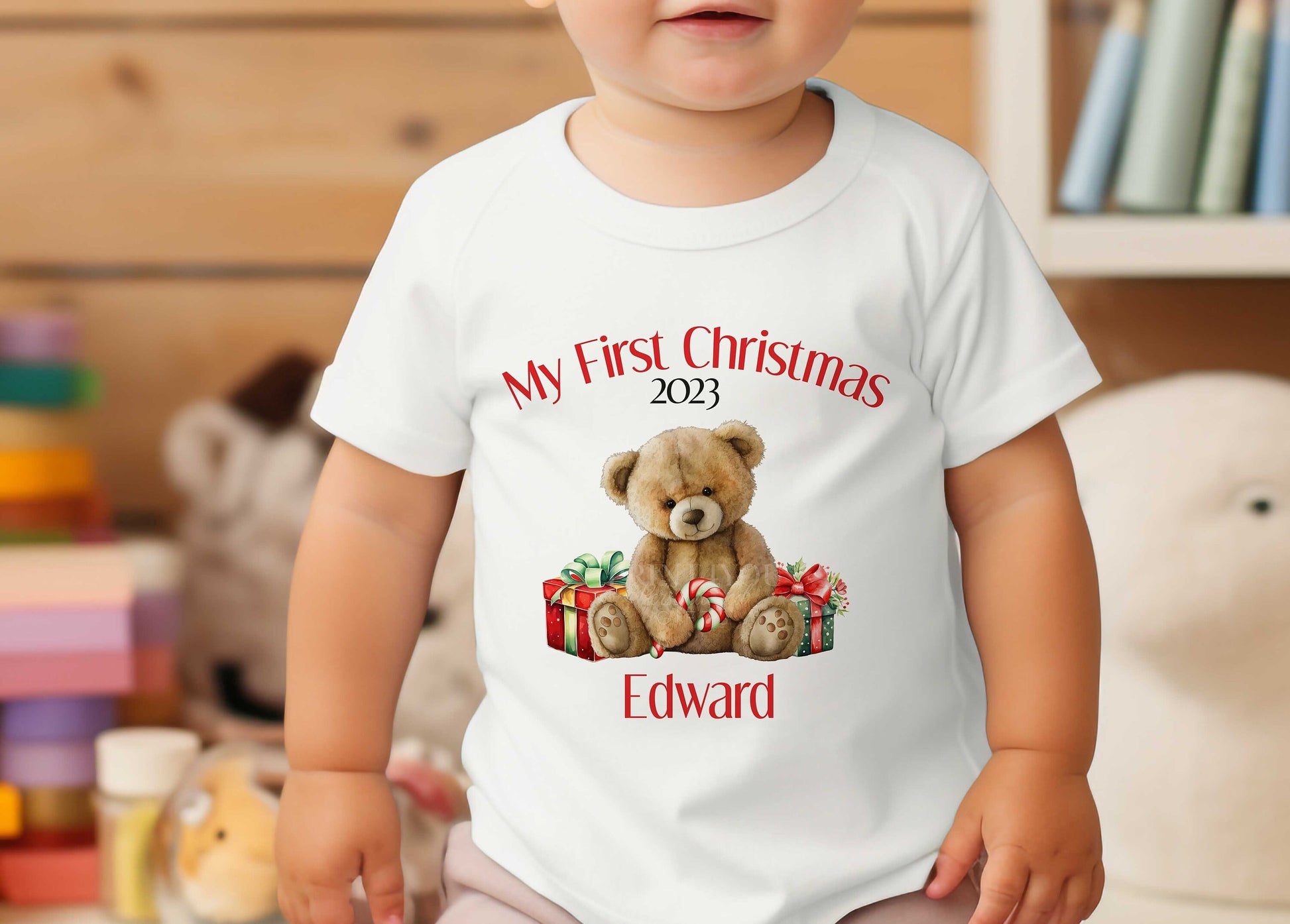 Personalised Baby's First Christmas sleepsuit with popper fastenings and teddy bear design.