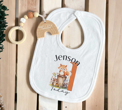 Soft cotton sleepsuit printed with the Woodland Fox first birthday design.