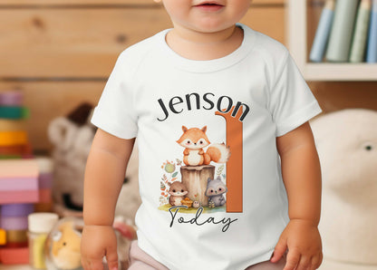 Personalised Woodland Fox first birthday t-shirt shown on soft white cotton fabric.