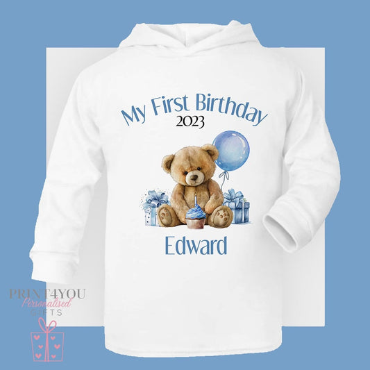 Boys personalised teddy 1st birthday hooded t-shirt in size 6-12 months, printed with a custom name.