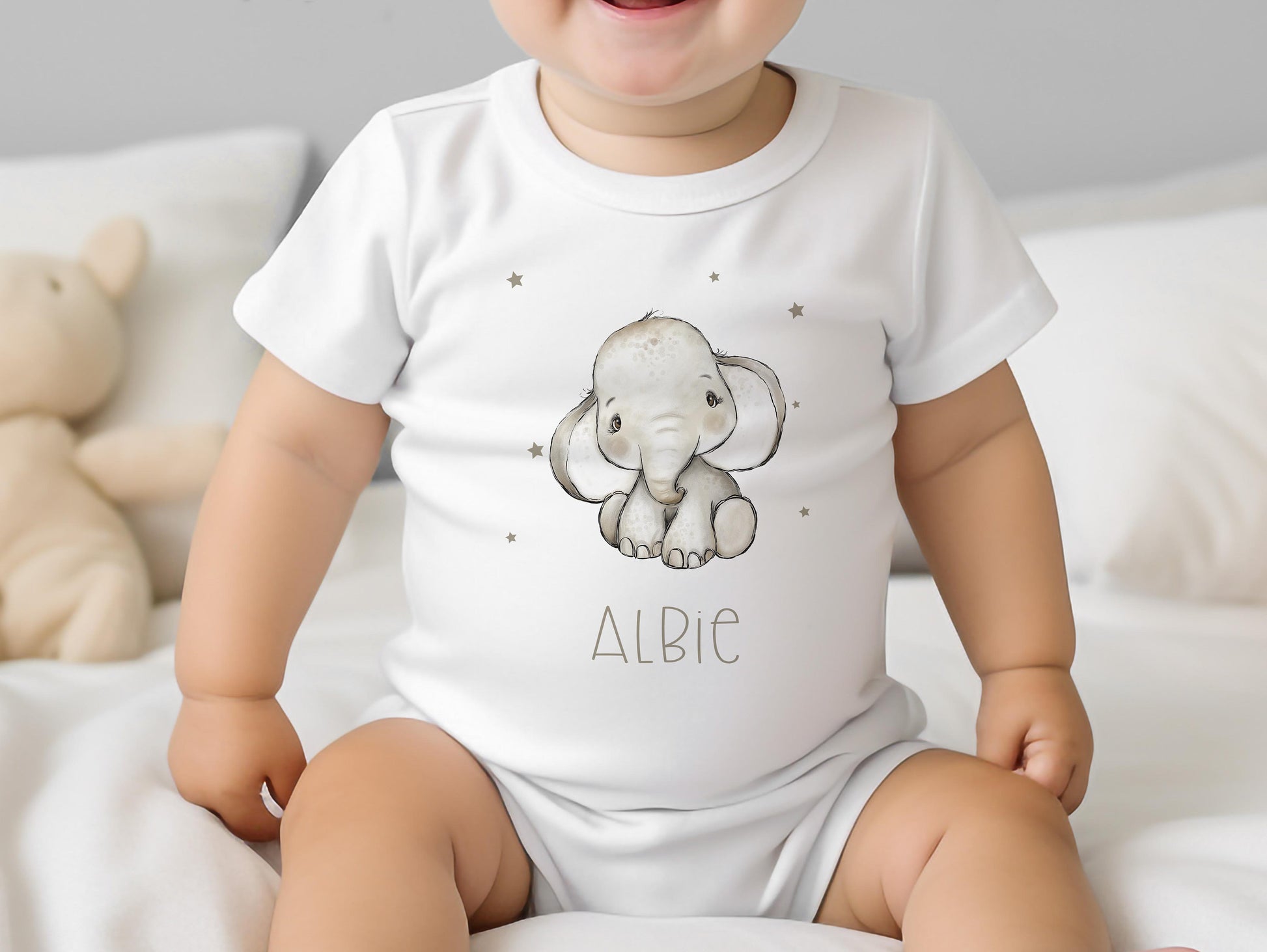 Personalised grey baby elephant bib, printed with your baby's name on soft white cotton.