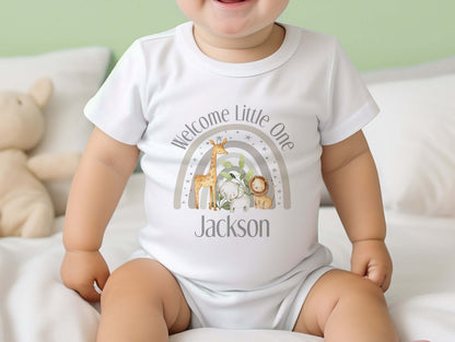 Personalised welcome baby grey safari gift set styled flat, showing vest, sleepsuit and bib.