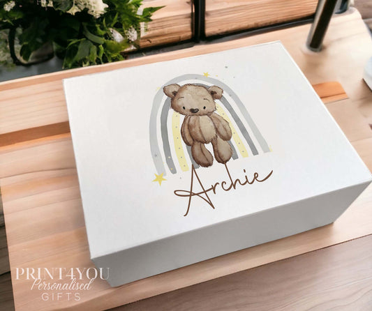 Medium white personalised gift box with magnetic lid, printed with a teddy bear and grey rainbow design and the name Archie