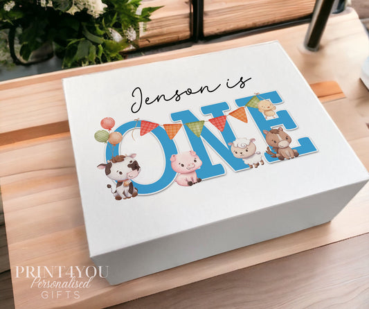 White magnetic-close keepsake box printed with farm animals, balloons and bunting spelling out 'Jenson is ONE'