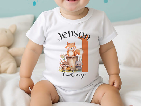 White personalised baby bib printed with the Woodland Fox first birthday design.