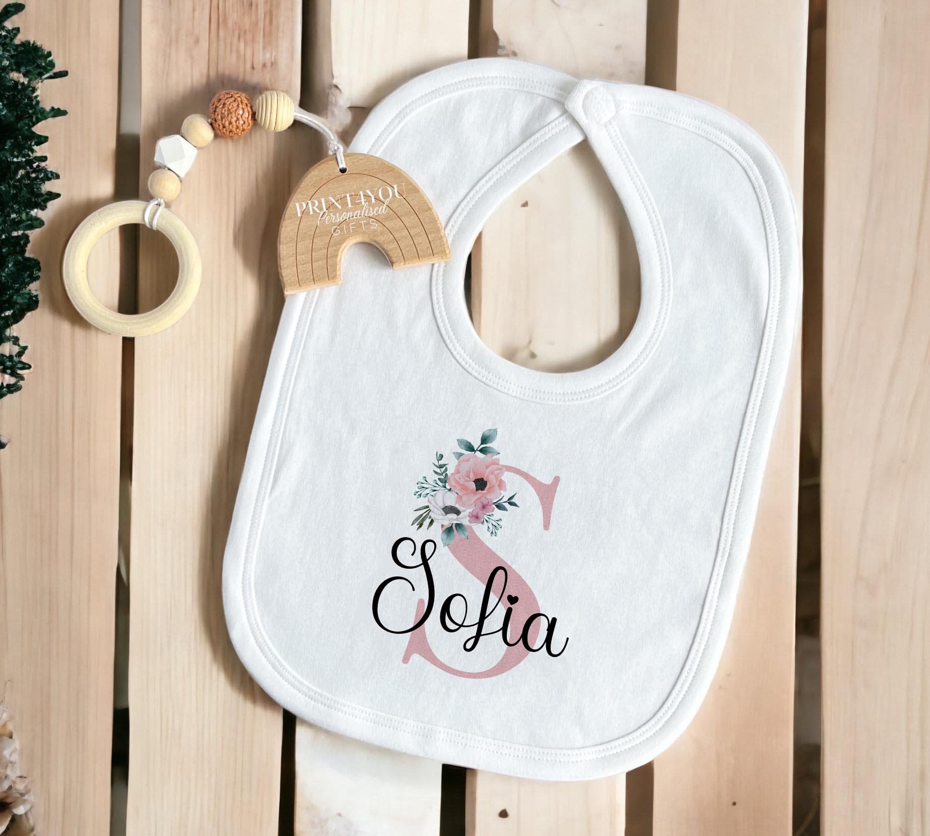Close-up of the pink floral design with personalised initial letter and name text.