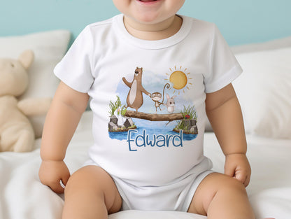 Personalised new baby bib printed with the animals on a log design and baby's name.