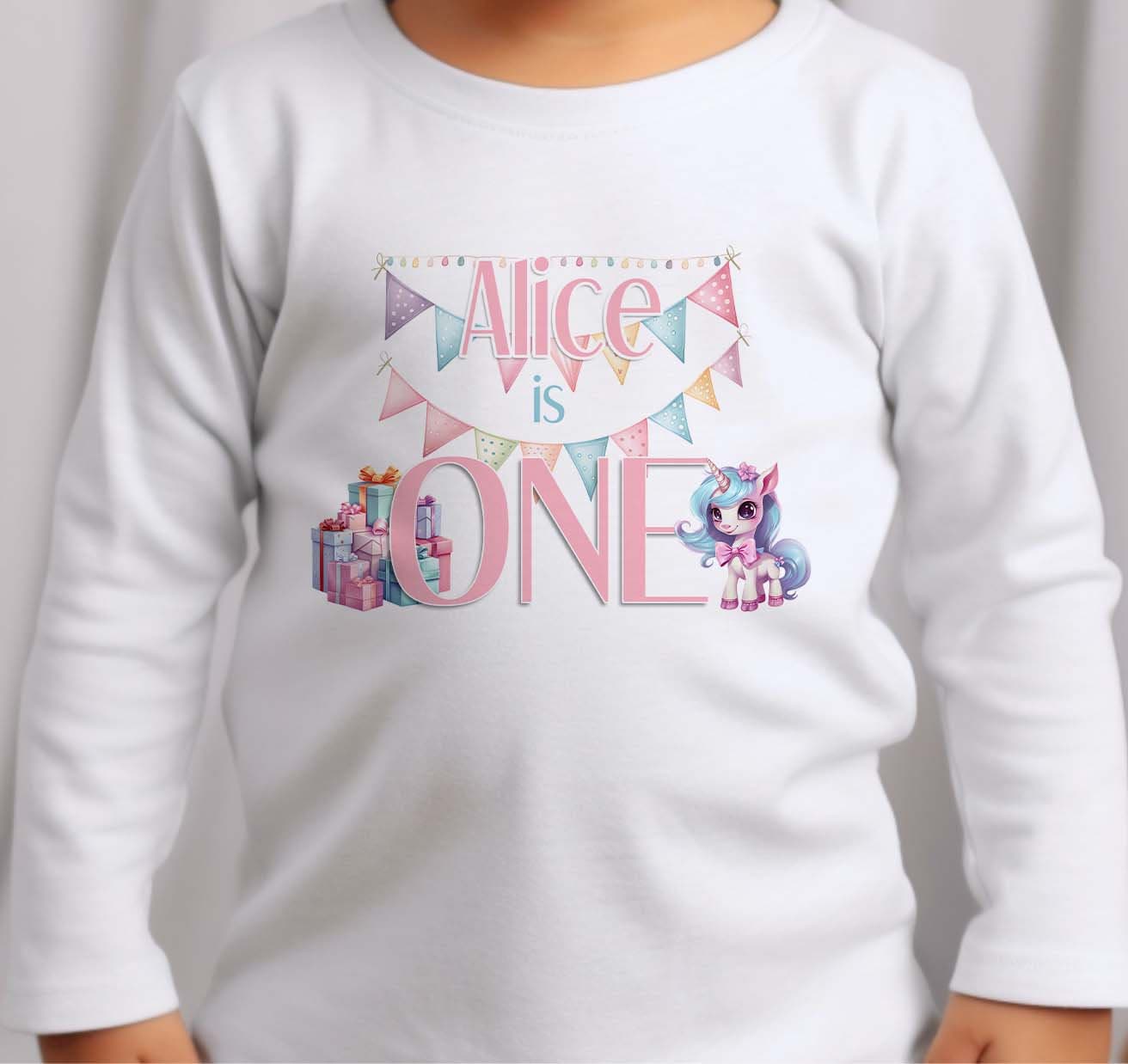 Personalised Unicorn first birthday t-shirt in white cotton featuring a custom name, number one and unicorn design.