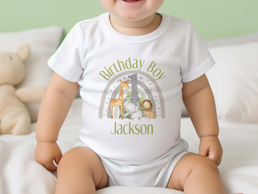 Personalised safari rainbow 1st birthday bib with baby's name printed on soft white cotton.