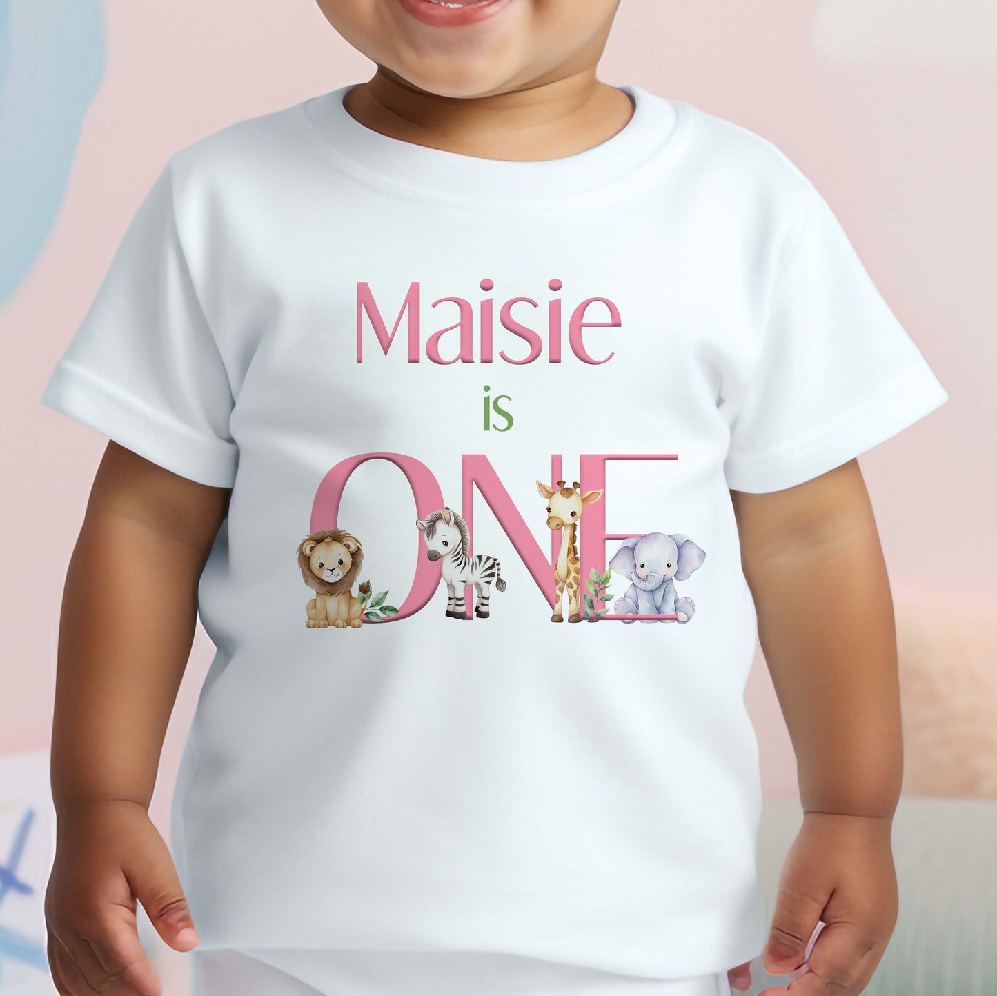 Bib in soft white cotton printed with the safari animal design in pink text.